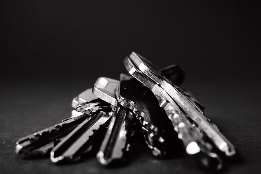 A set of property keys resting on a dark surface.